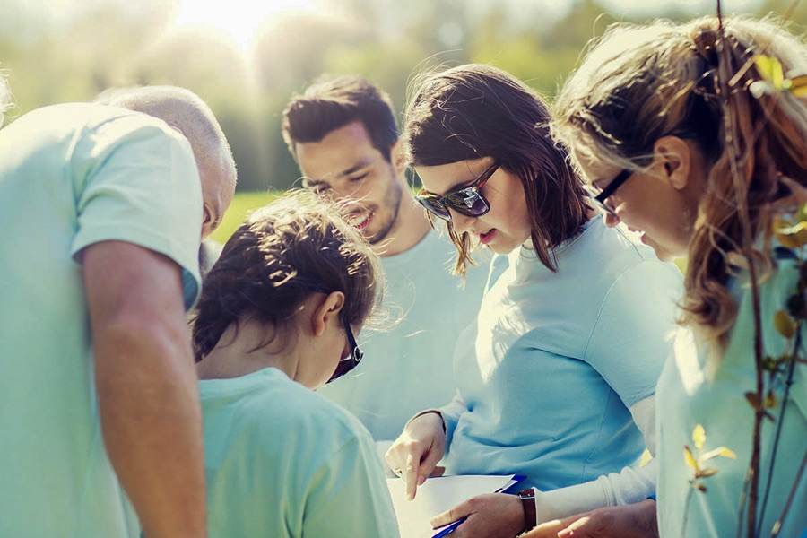A volunteer group planning a neighborhood tree-planting project