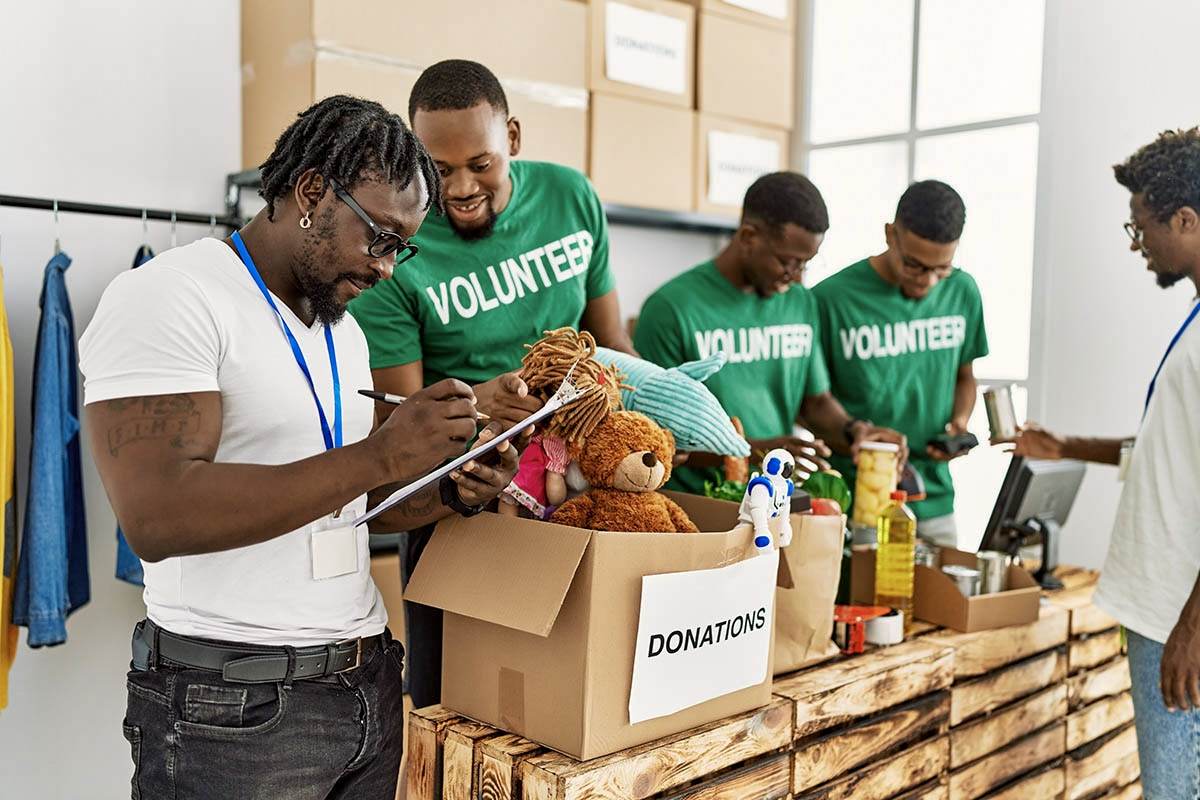 Volunteers packing donation boxes for a local charity partner